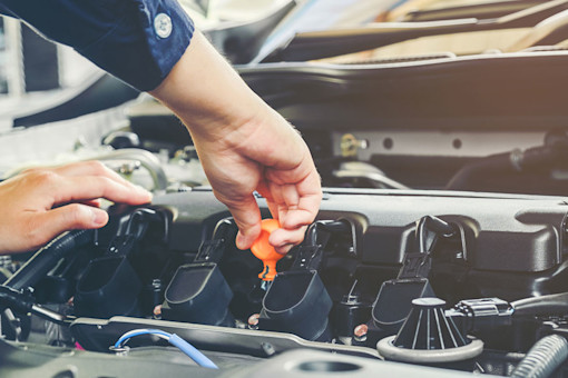 Car mechanic working in auto repair service