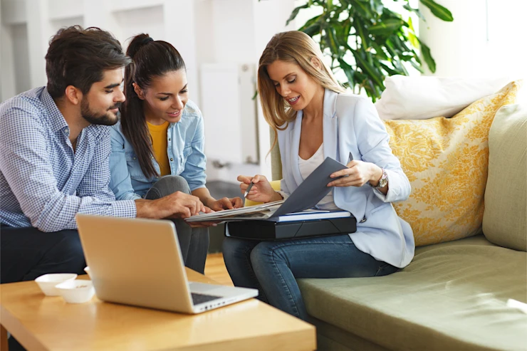 dearborn - woman discussing with couple at home