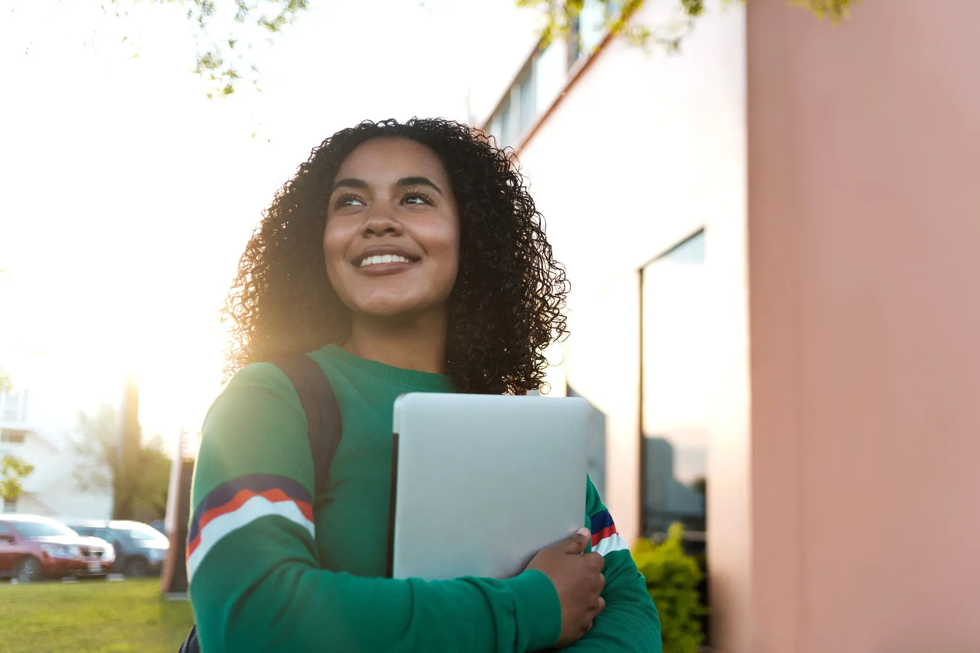 A girl holding her laptop
