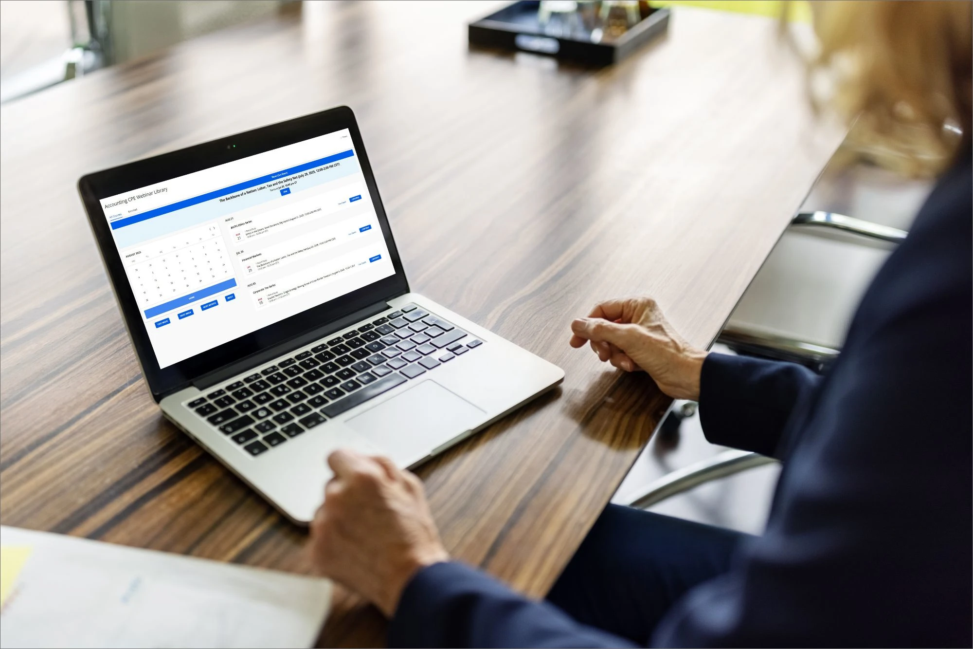 woman looking at accounting course on laptop