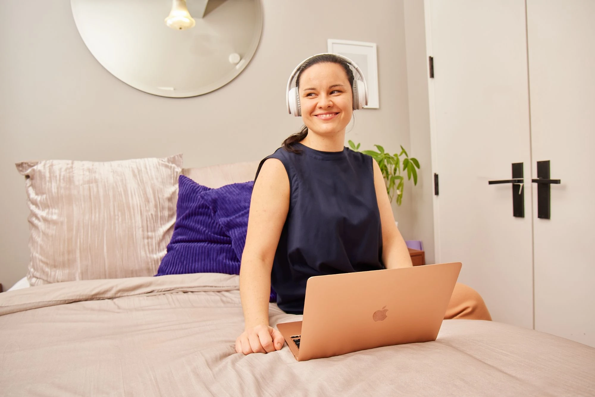 Career Areas - Student Brand Ambassador - woman in home with laptop and headphones