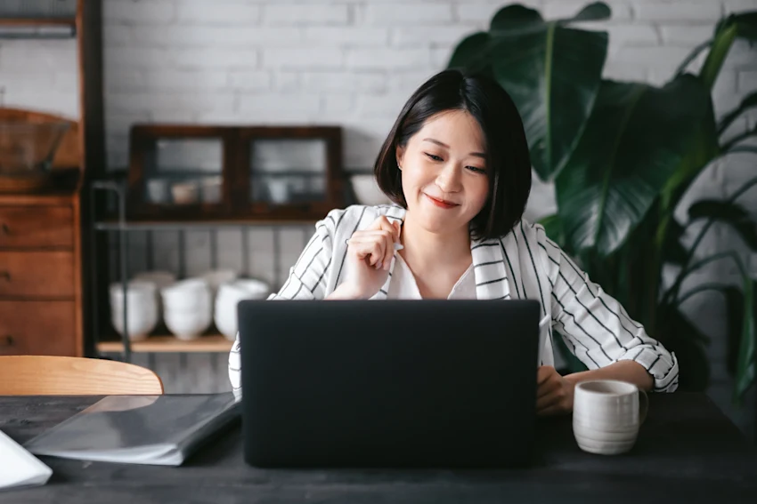 Woman Looking at Laptop
