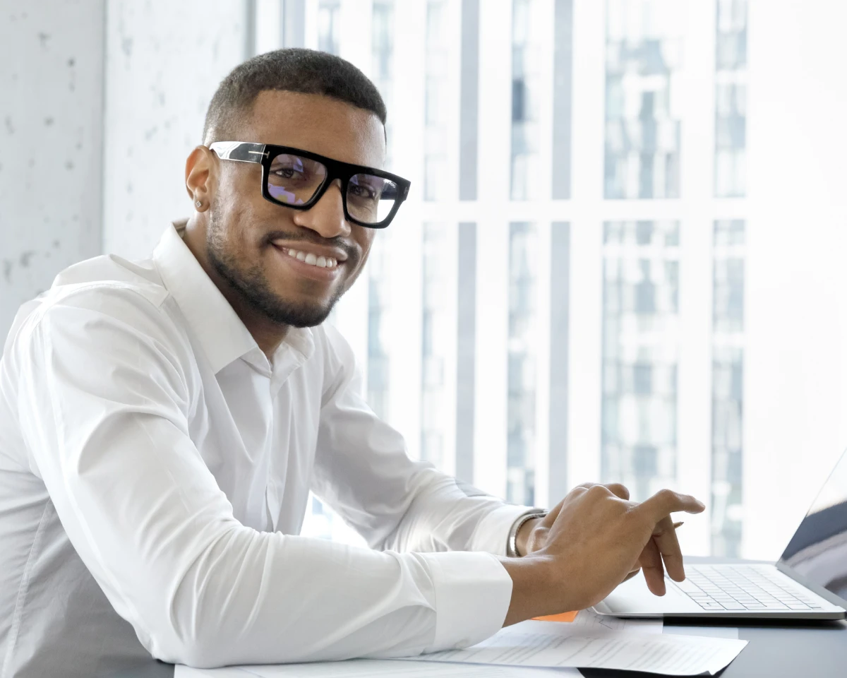 Legal - man with glasses working laptop
