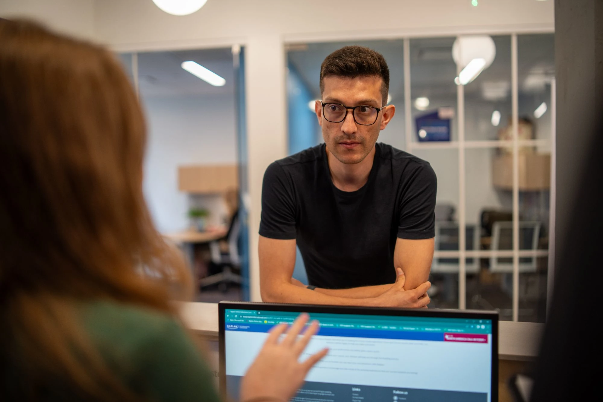 Career Areas - Customer Service - man discussing with colleague coworker