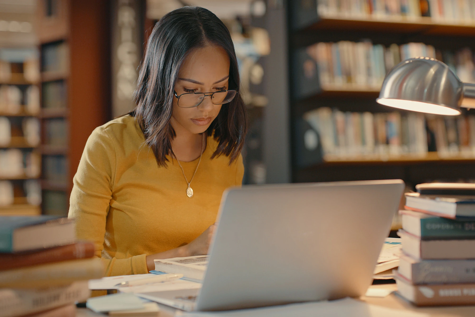 University of Texas - Austin student studying in library