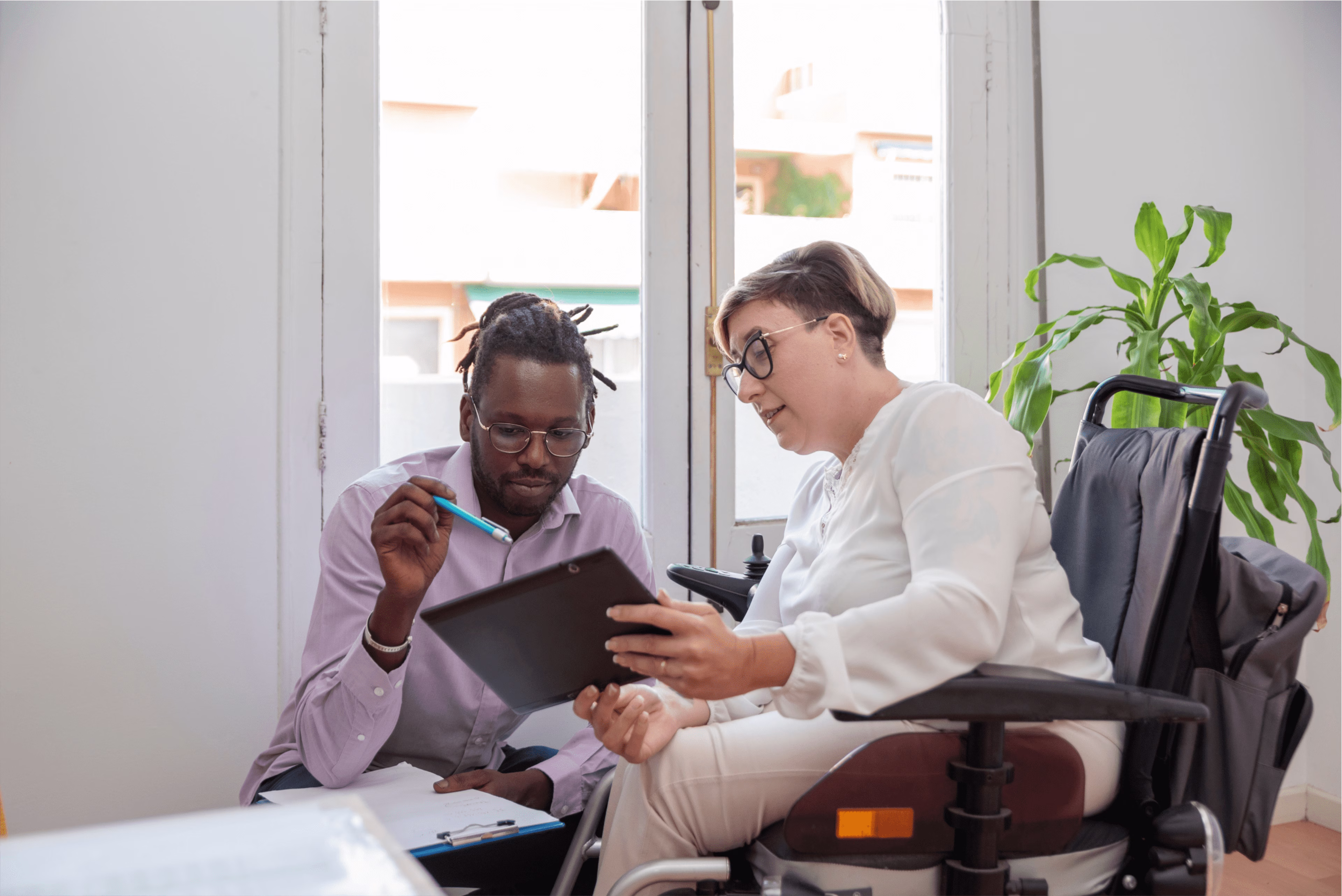 Business Meeting in Office with Laptops and Plants