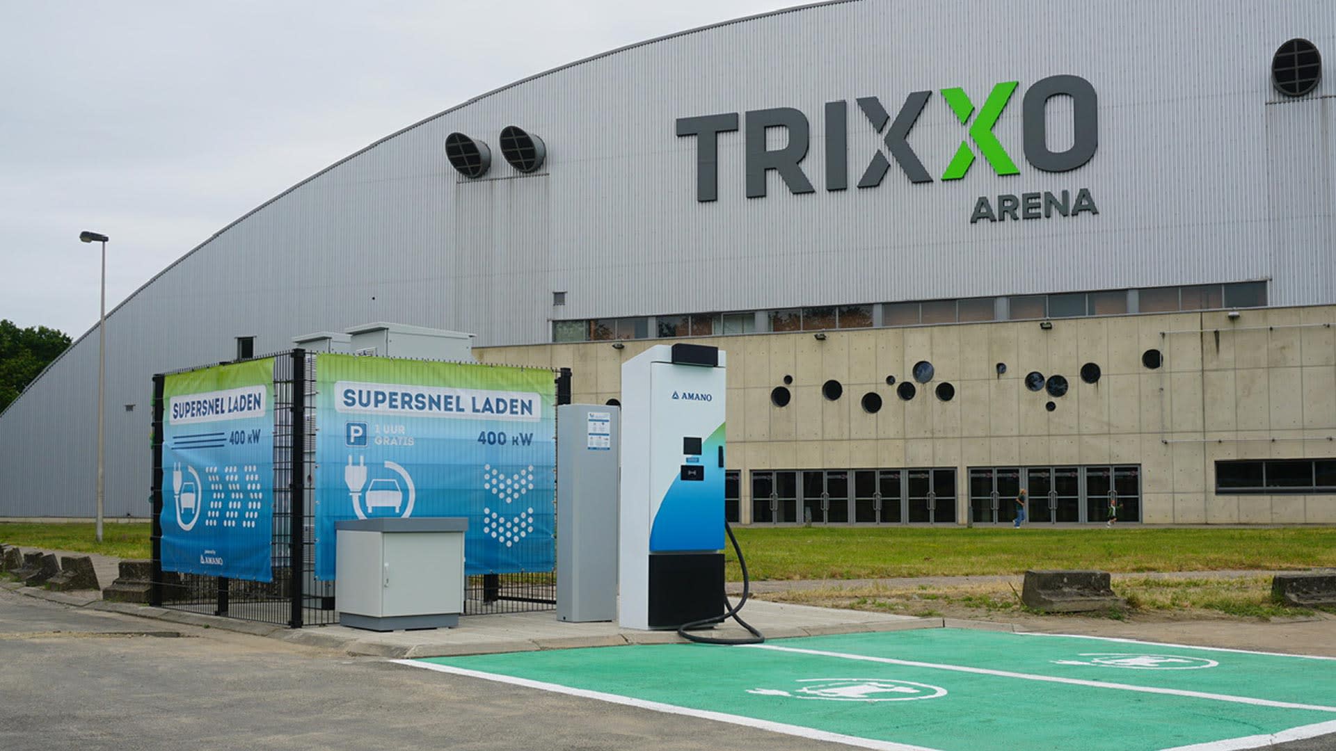 Electric vehicle charging stations at Park H in front of Trixxo Arena in Hasselt, with fast chargers and dedicated charging spaces near the event venue.