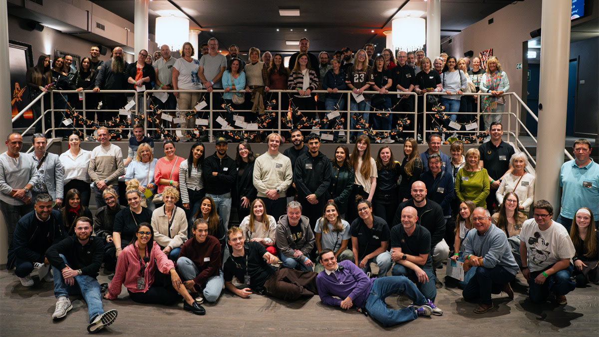 Group photo with about 80 employees taken during the Starter Pack event at Forest National.