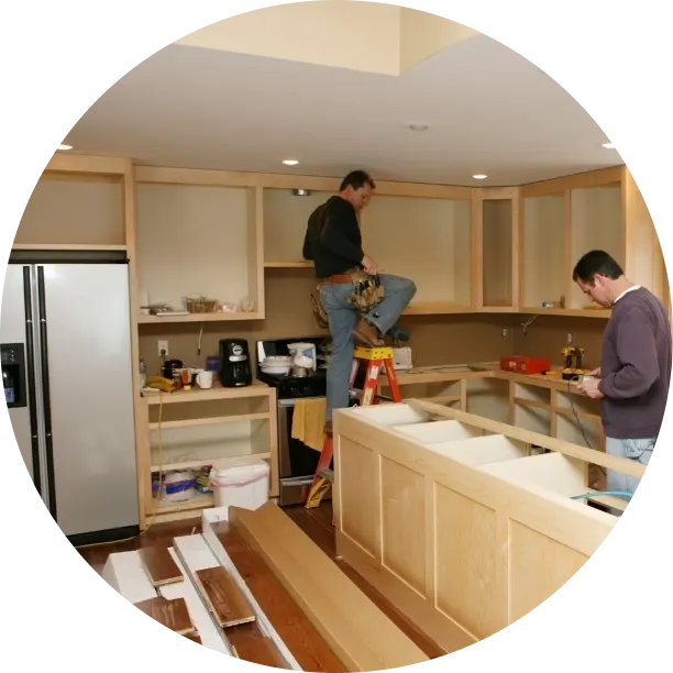 Two construction works working on a home remodel