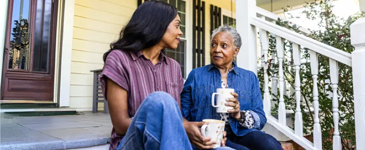 A mother and daughter sharing a moment together at home.