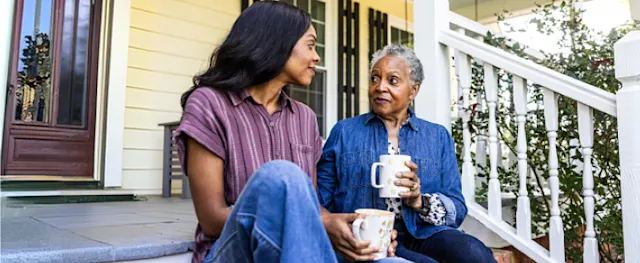 A mother and daughter sharing a moment together at home.
