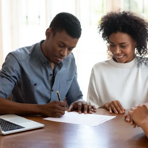 Merchant helping customer with paperwork