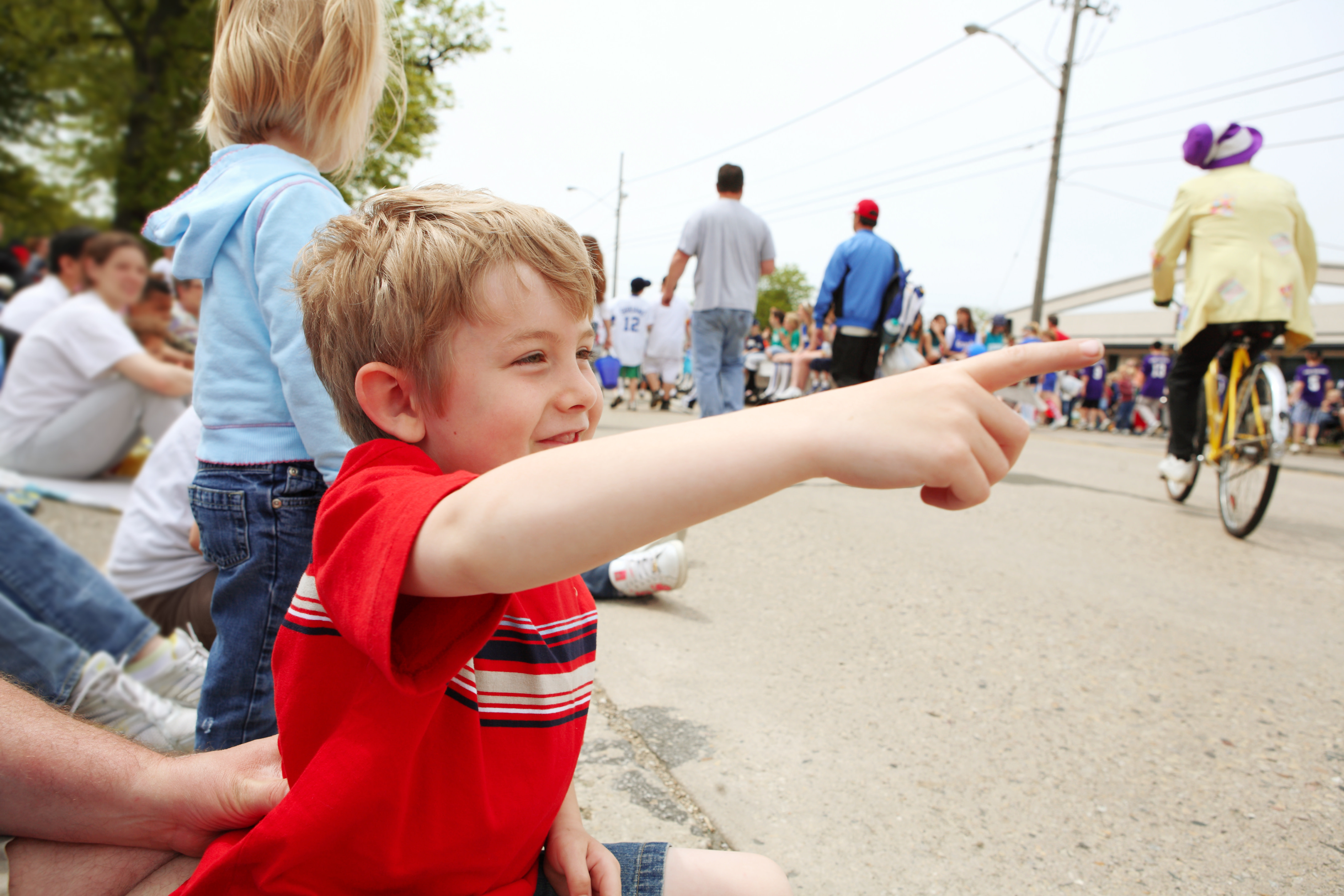 Boy watching a parade,