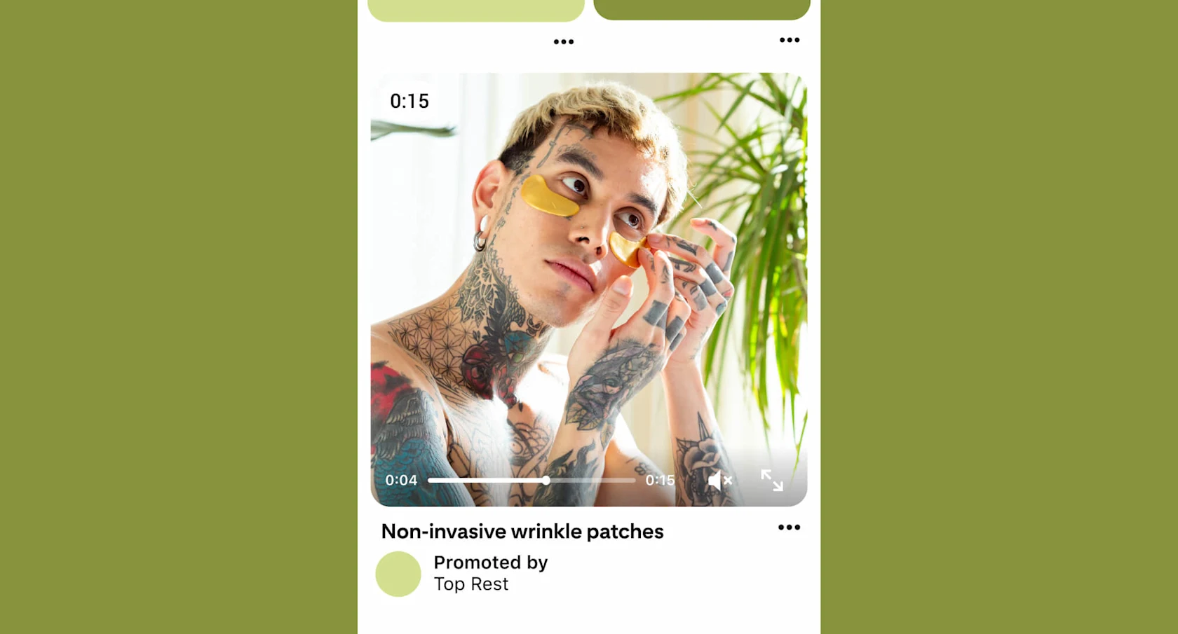 Tattooed man looks in the mirror as he applies gold under-eye patches