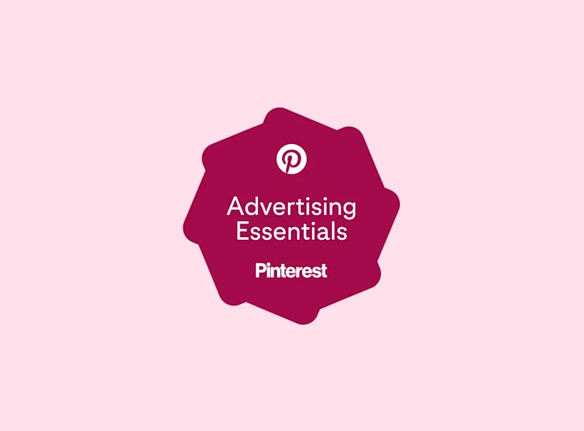 A plum-colored celebratory badge featuring the text "Advertising Essentials" and the Pinterest logo.
