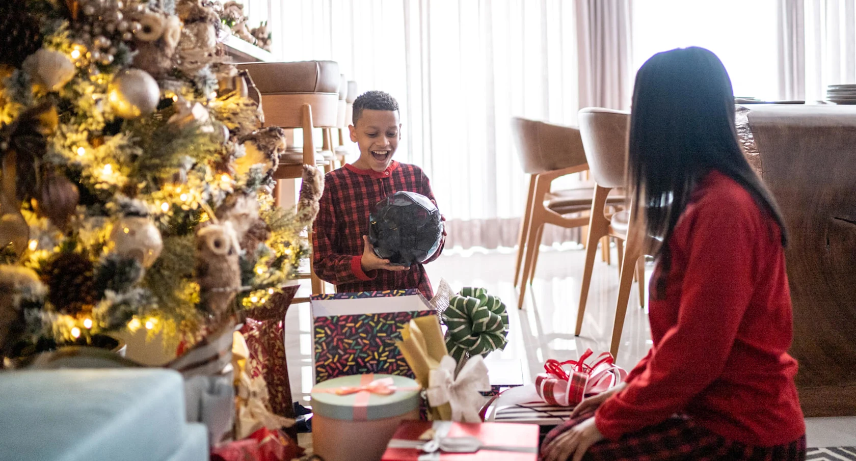 A group of football fans watching a match at home and celebrating