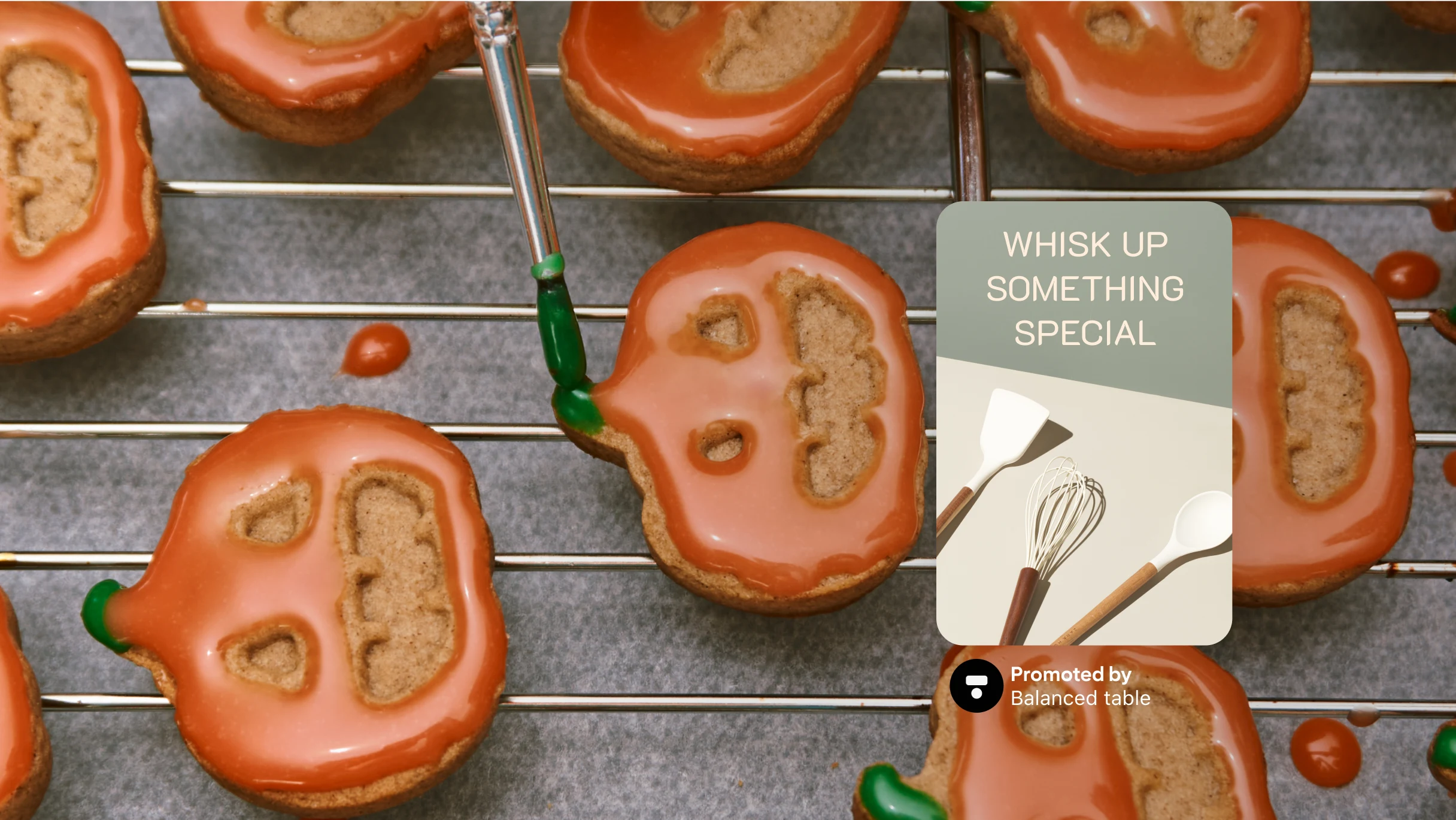 Full width image featuring a tray of cookies decorated as pumpkins, a Pin sits to the right featuring whisks with text “Whisk up something special”.
