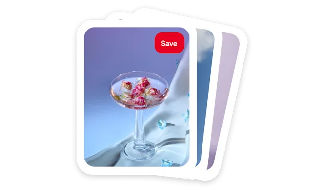 A colourful cocktail sits on white linen against a purple backdrop