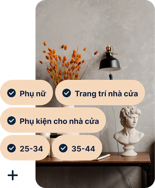 A Pin showing a desk with a vase of orange flowers, a black lamp and a bust of Michelangelo’s David with the search terms Women, Home decor, Home accessories, 25 to 34 and 35 to 44