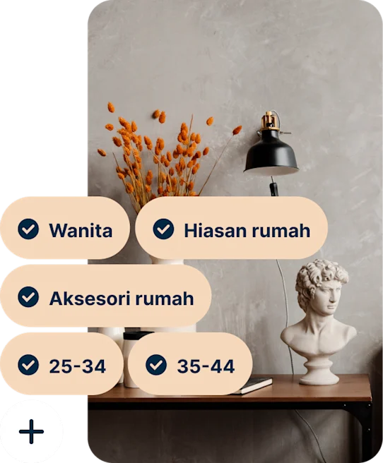 A Pin showing a desk with a vase of orange flowers, a black lamp and a bust of Michelangelo’s David with the search terms Women, Home decor, Home accessories, 25 to 34 and 35 to 44