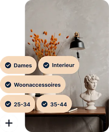 A Pin showing a desk with a vase of orange flowers, a black lamp and a bust of Michelangelo’s David with the search terms Women, Home decor, Home accessories, 25 to 34 and 35 to 44