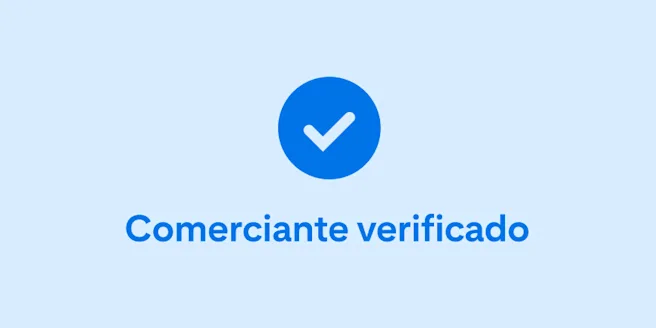Una marca de verificación de color azul oscuro y las palabras “Comerciante verificado” en el centro sobre un fondo celeste.