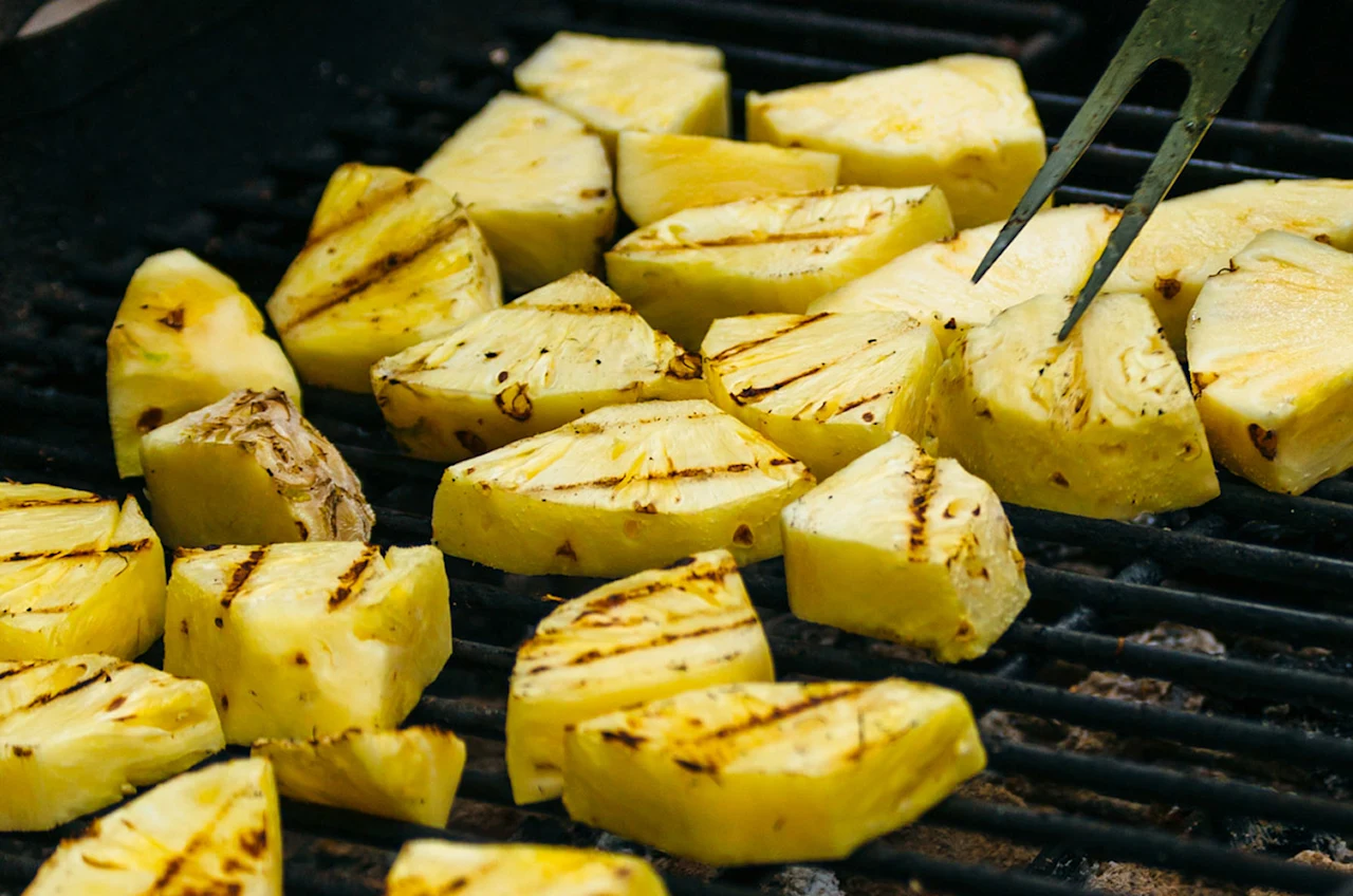 Pieces of pineapple on a grill