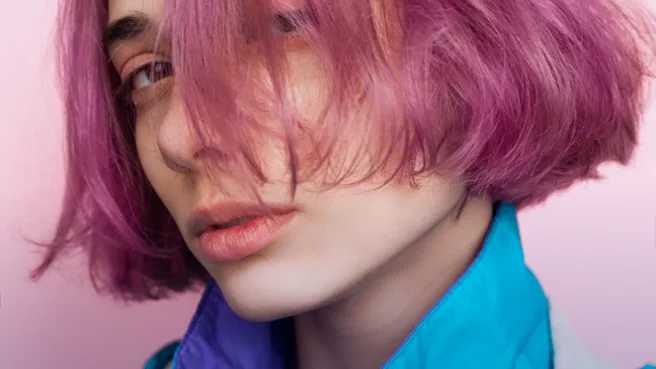 A woman with pink hair