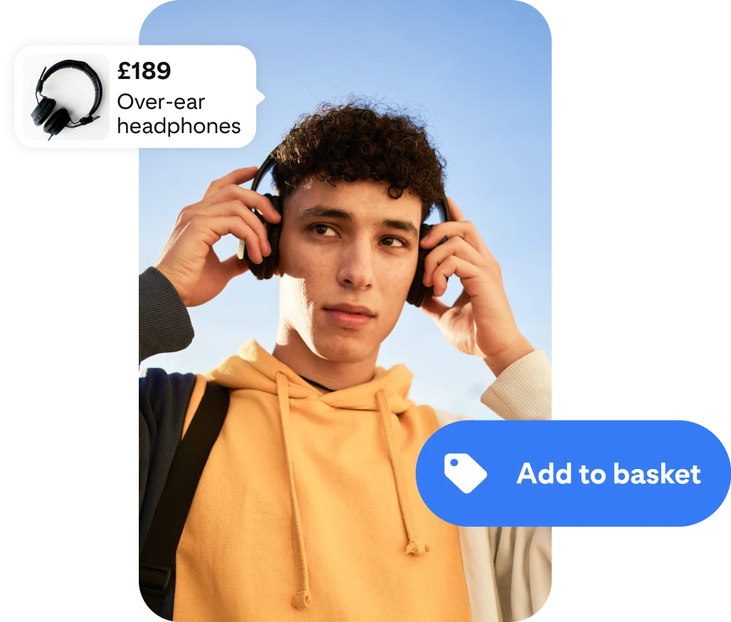 A photo of a young man using headphones, framed on either side by an ad for wireless headphones and an ‘Add to basket’ button