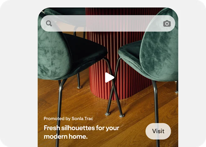 A Premiere Spotlight ad features a full-width video showing green velvet chairs.
