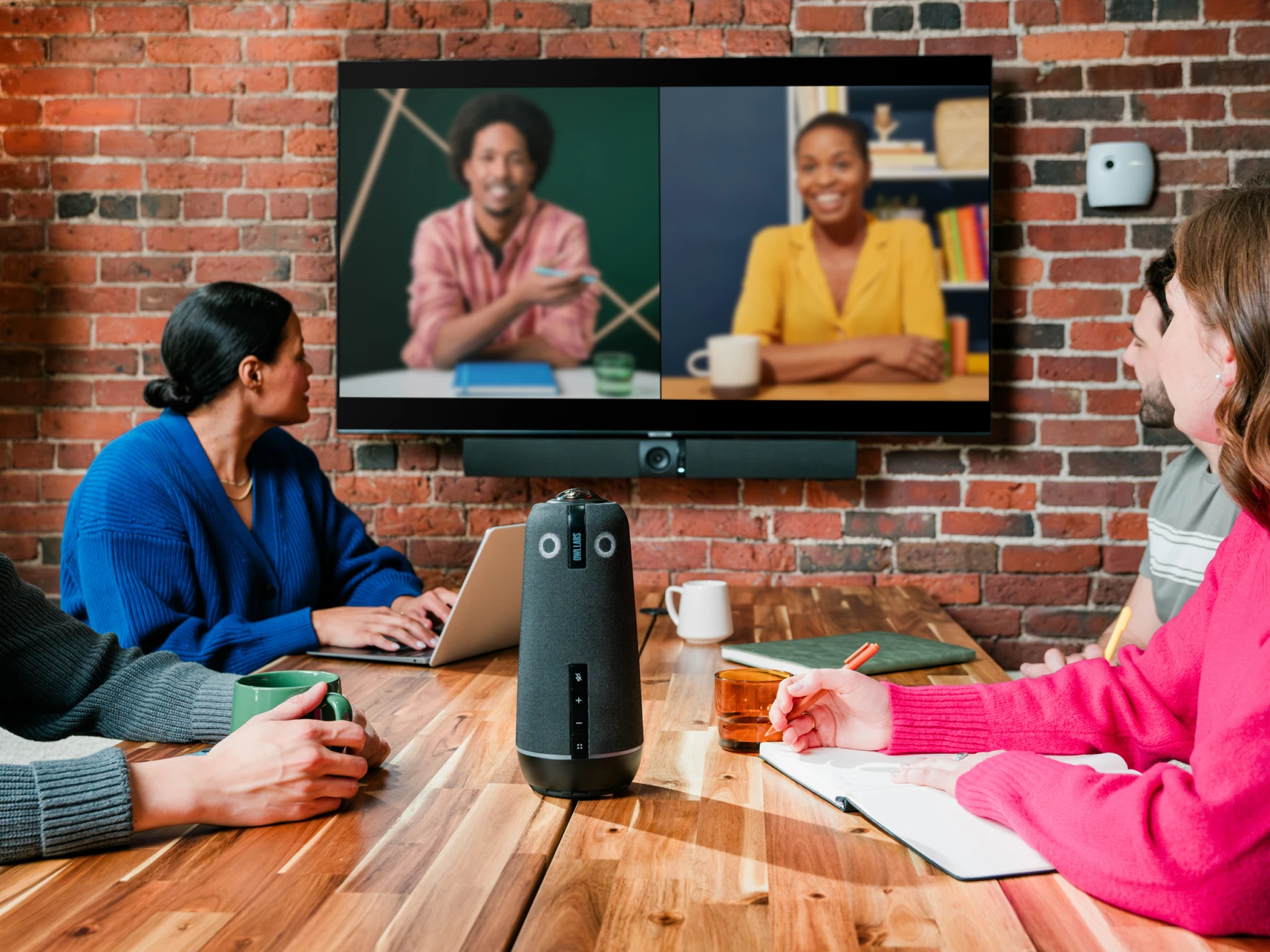 Owl Bar featured with Meeting Owl in a large video conference meeting