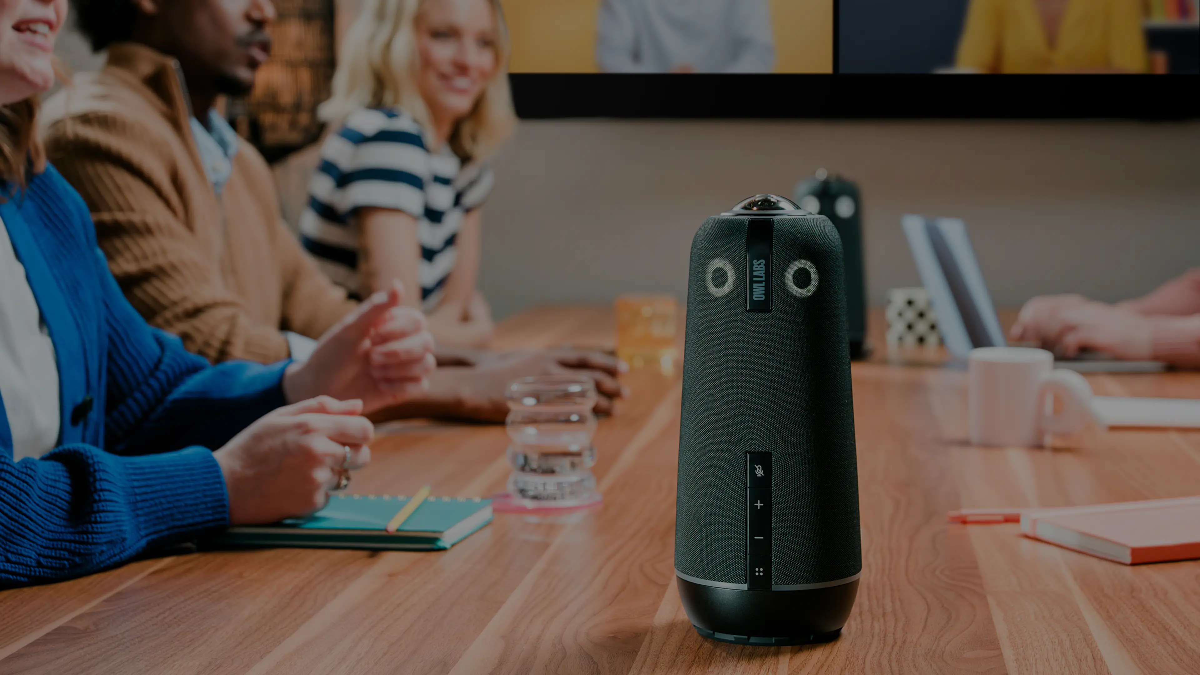 Owl Labs business industry image featuring Meeting Owls in a conference room with business professionals