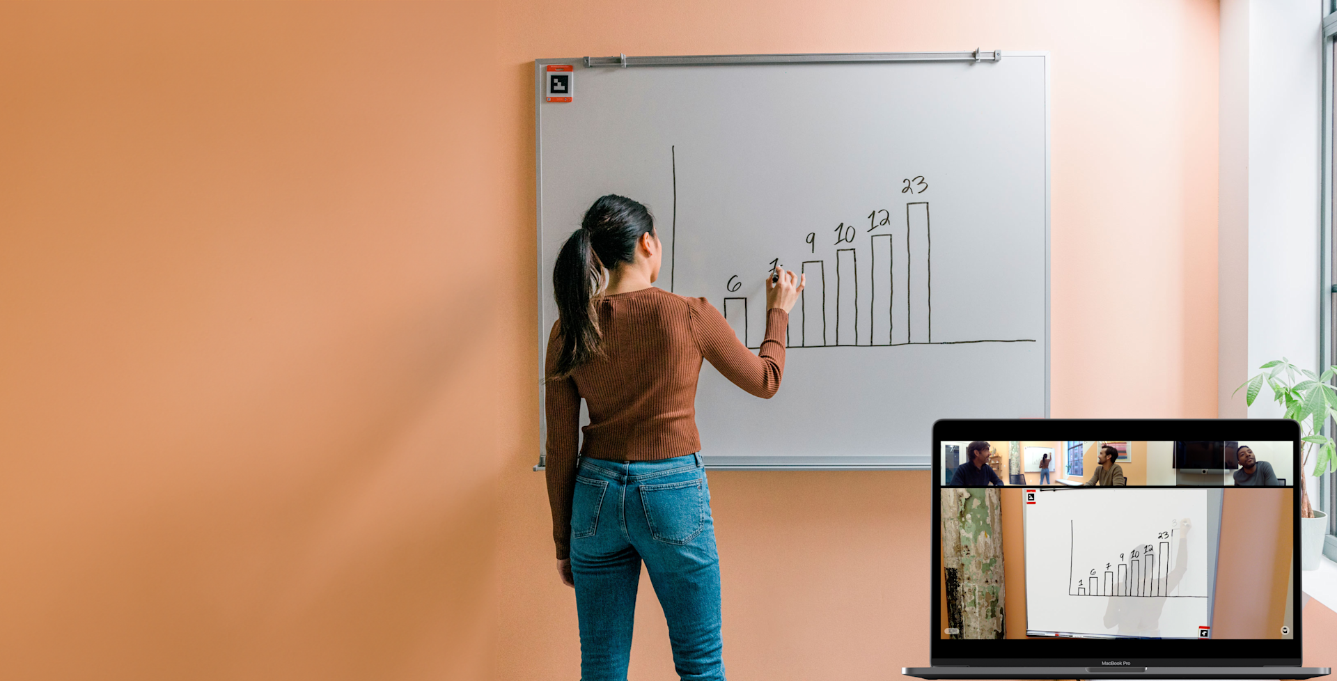 Instructor writing on Whiteboard using Whiteboard Owl technology for hybrid education on laptop