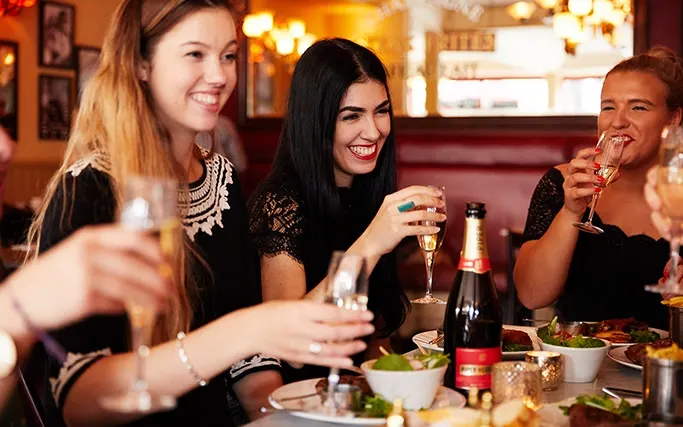 Smiling guests with glasses of bubbles Smiling guests with glasses of bubbles