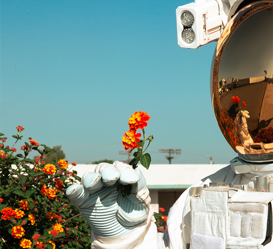 03 Mission Still Astronaut wFlower 1098x1000
