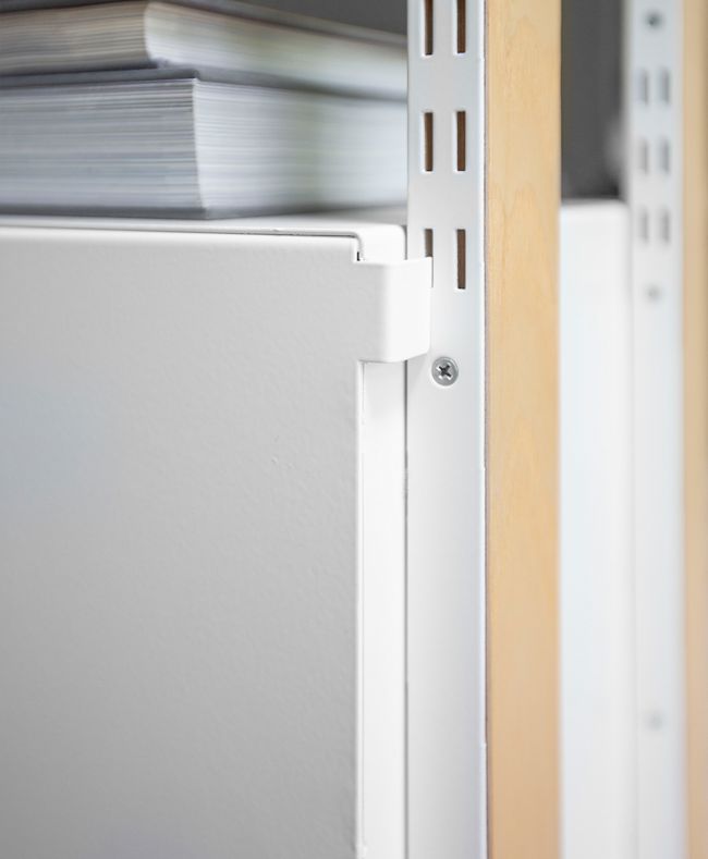Rear track system of the white cabinet