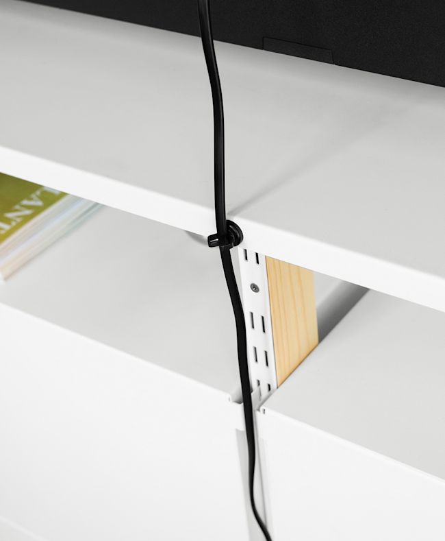 Cord Management shown hiding a cord down the back middle wood support.