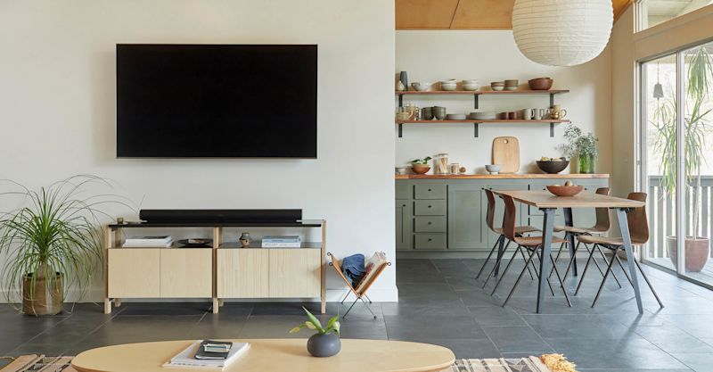 Media Console with an Oval Coffee Table in the foreground