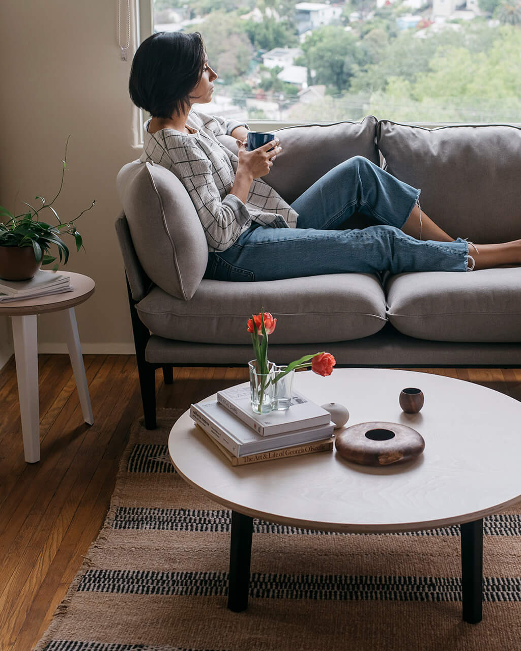 La living room with sofa and coffee table mobile