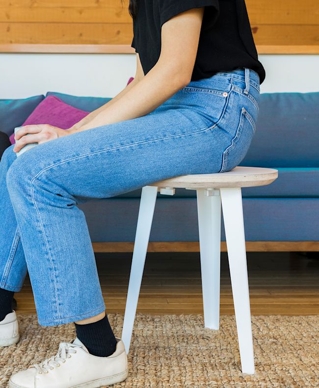 The Floyd Side Table used as a stool.