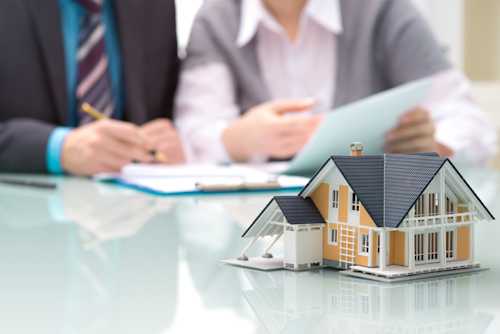 People sitting at a table discussing financing