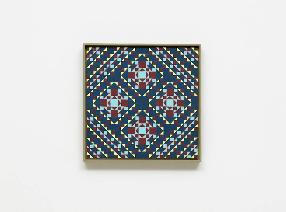 A colorful, intricate grid painting installed on a white wall.