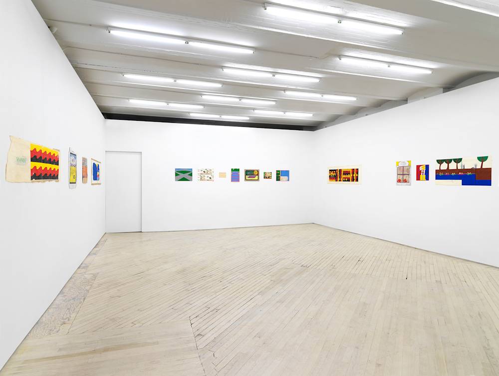 In a gallery space, a series of small works on paper are installed close together on a white walls. The drawing are clustered in groups. The drawings depict abstracted, cartoon-like character scenes in various patterns, open or enclosed architectural spaces. The sizes of the paper vary in length and proportion.