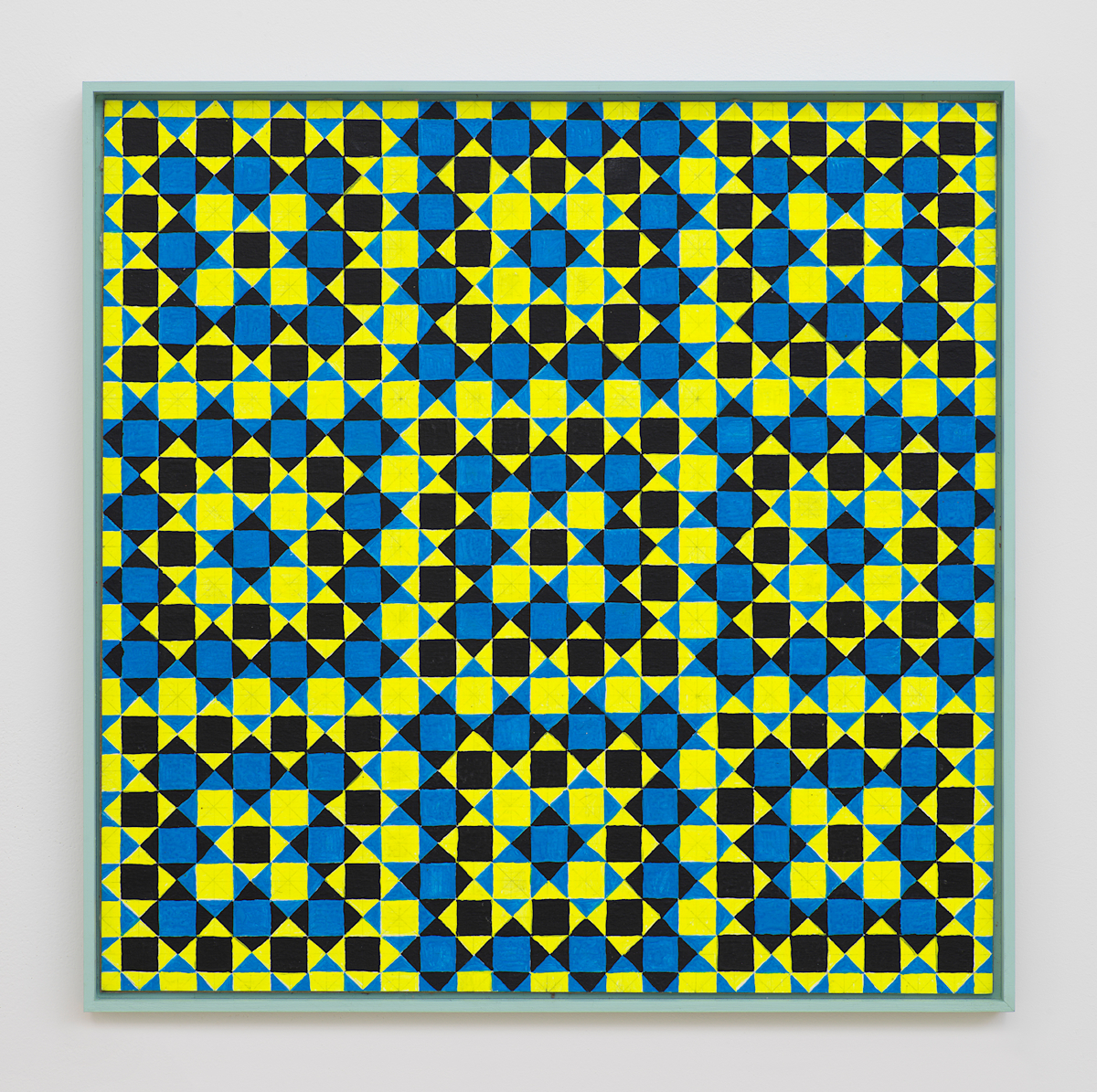 On a white wall a painting depicting a grid of crisscrossing lines generating many repeating rectangles, and triangles. The dominant colors are hues of green, yellow, blue, and black. The frame is painted green.