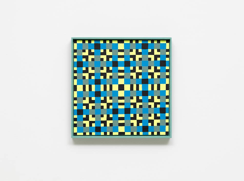 A colorful, intricate grid painting installed on a white wall.