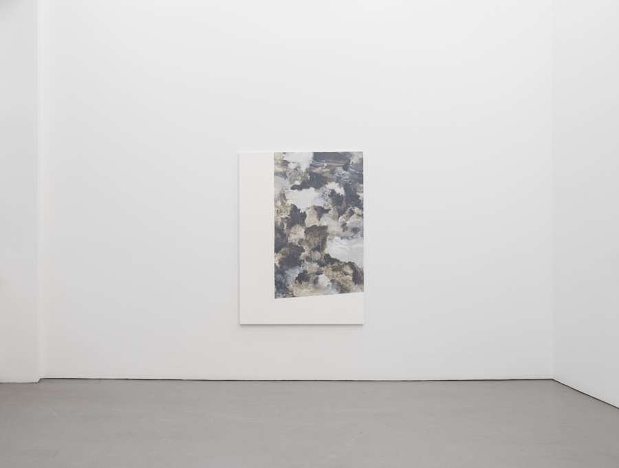 Installation view of one painting by Viktor Kopp depicting an application of thin, washy paint in an abstract and gestural manner. The is black and white with the majority of the paint sequestered to the top right of the painting.