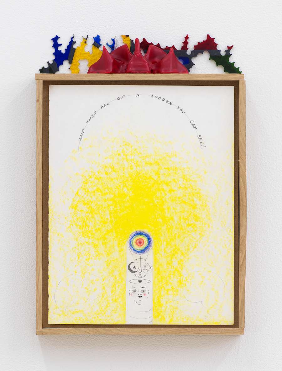 Image of Harry Gould Harvey IV drawing framed in foraged oak wood, depicting lines of text in an arch above a cloudy wash of yellow pigment, with a bullseye near the bottom of the drawing and religious symbols. A decorative red wax form with multicolored plexiglass rests on the top of the frame.