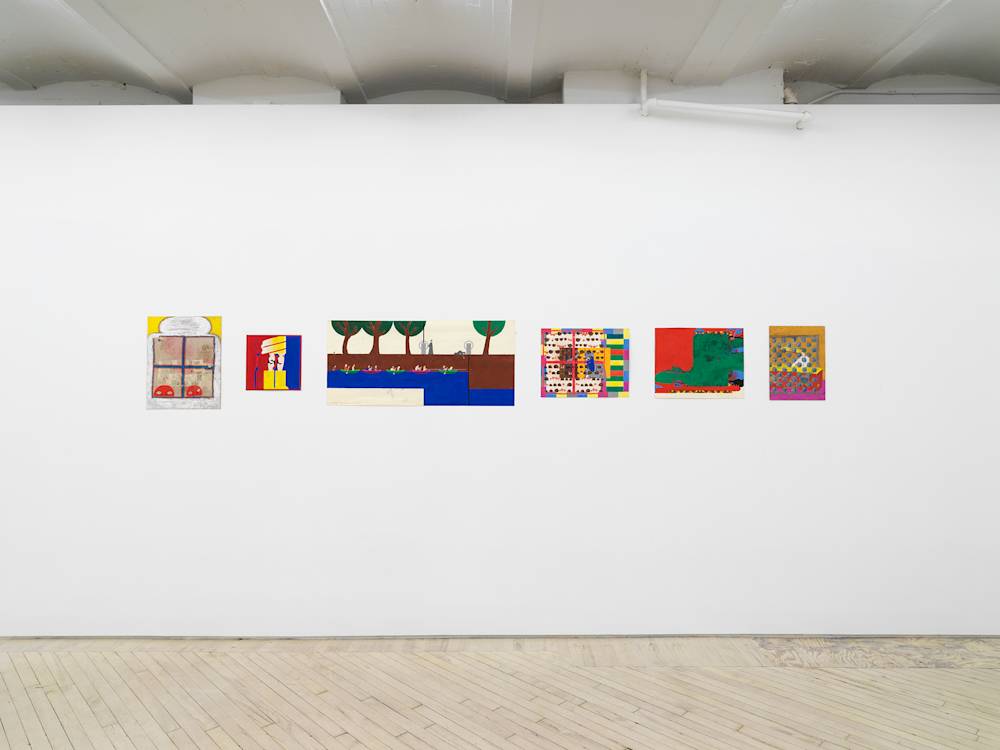 In a gallery space, a series of small works on paper are installed close together on a white wall. The drawings are clustered in a group. The drawings depict abstracted, cartoon-like character scenes. The sizes of the paper vary in length and proportion. There are interior spaces and exterior spaces depicted.