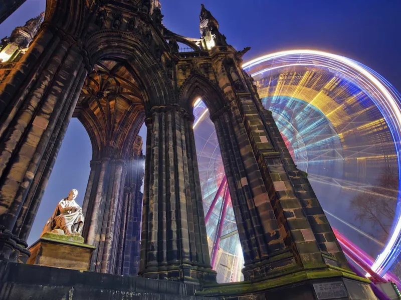 Scott-Monument-and-russian-wheel-in-the-background-Edinburgh-Scotland