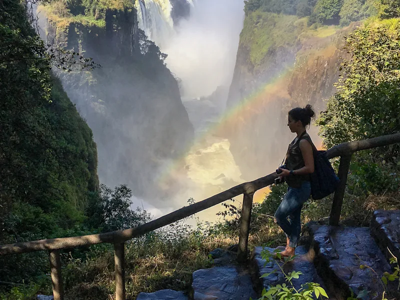 victoria-falls-lady-walking-zimbabwe